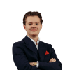 En profilbild av fastighetsmäklare Daniel Pavel