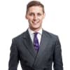 En profilbild av fastighetsmäklare Benjamin Karlsson