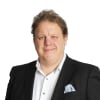 En profilbild av fastighetsmäklare Mikael Kellander