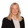 En profilbild av fastighetsmäklare Victoria Hallberg