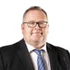 En profilbild av fastighetsmäklare Kent Lundgren