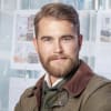 En profilbild av fastighetsmäklare Jonathan Leding