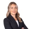 En profilbild av fastighetsmäklare Andrea Markusson