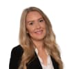 En profilbild av fastighetsmäklare Eveline Ahx