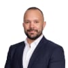 En profilbild av fastighetsmäklare Joel Nylund
