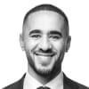 En profilbild av fastighetsmäklare Ayman Darrar