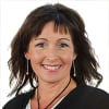 En profilbild av fastighetsmäklare Ulrica Johansson