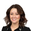 En profilbild av fastighetsmäklare Mia Harbrecht