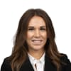 En profilbild av fastighetsmäklare Olivia Carlström