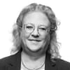 En profilbild av fastighetsmäklare Agnetha Pettersson