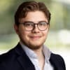 En profilbild av fastighetsmäklare Hugo Margolis