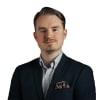 En profilbild av fastighetsmäklare Christopher Bergquist
