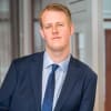 En profilbild av fastighetsmäklare David Johansson