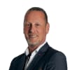 En profilbild av fastighetsmäklare Andreas Norgren