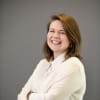 En profilbild av fastighetsmäklare Madeleine Jonsson