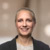 En profilbild av fastighetsmäklare Michaela Holmgren