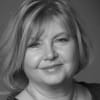 En profilbild av fastighetsmäklare Anne Wallén