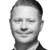 En profilbild av fastighetsmäklare Magnus Wiebe