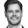 En profilbild av fastighetsmäklare Fredrik Lindberg