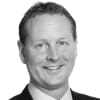 En profilbild av fastighetsmäklare Hans Berggren