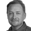 En profilbild av fastighetsmäklare Martin Olofsson