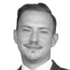 En profilbild av fastighetsmäklare Florid Krasniqi
