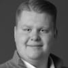 En profilbild av fastighetsmäklare Albin Persson