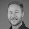 En profilbild av fastighetsmäklare Kristian Sundberg