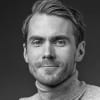 En profilbild av fastighetsmäklare David Moberg