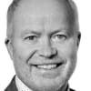 En profilbild av fastighetsmäklare Lars-Åke Helin