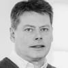 En profilbild av fastighetsmäklare Hans Lundgren