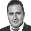 En profilbild av fastighetsmäklare Andreas Yacoub
