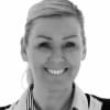En profilbild av fastighetsmäklare Karin Andersson