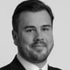 En profilbild av fastighetsmäklare Sebastian Wallster