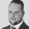 En profilbild av fastighetsmäklare Oskar Lund