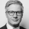 En profilbild av fastighetsmäklare Eric Melkersson