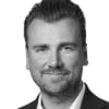 En profilbild av fastighetsmäklare Michael Lundholm