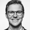 En profilbild av fastighetsmäklare Jacob Iwarsson