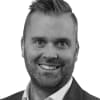 En profilbild av fastighetsmäklare Martin Lundgren