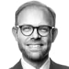 En profilbild av fastighetsmäklare Johan Aspenberg