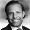 En profilbild av fastighetsmäklare Magnus Wangerheim