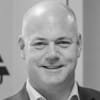 En profilbild av fastighetsmäklare Johan Persson