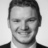 En profilbild av fastighetsmäklare Jonathan Léman