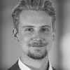 En profilbild av fastighetsmäklare Alexander Björklund