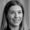 En profilbild av fastighetsmäklare Lisa Lavin