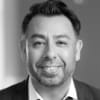 En profilbild av fastighetsmäklare Claudio Pino