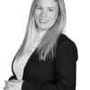 En profilbild av fastighetsmäklare Tina Högstedt