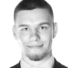 En profilbild av fastighetsmäklare Christian Cindric
