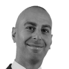 En profilbild av fastighetsmäklare Filip Bahno