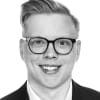 En profilbild av fastighetsmäklare Kevin Gustavsson